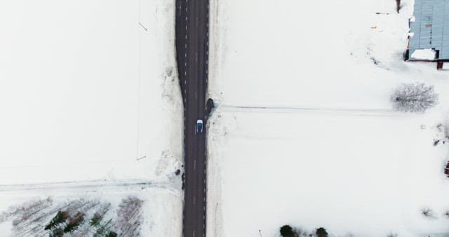 Car driving on a snow-covered road