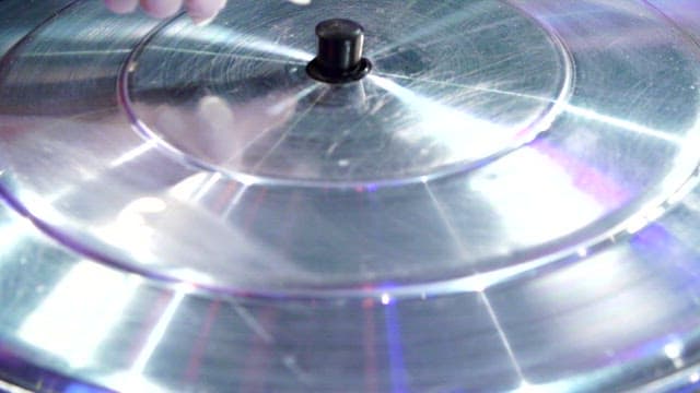 Chicken hotpot with various ingredients boiling in a cauldron