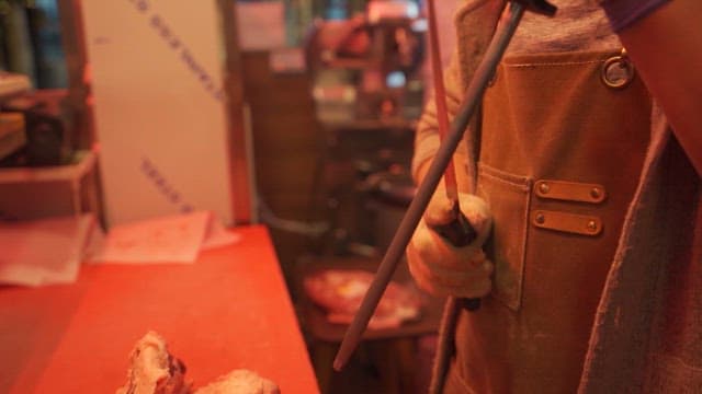 Artisan Preparing Meat in a Butcher Shop