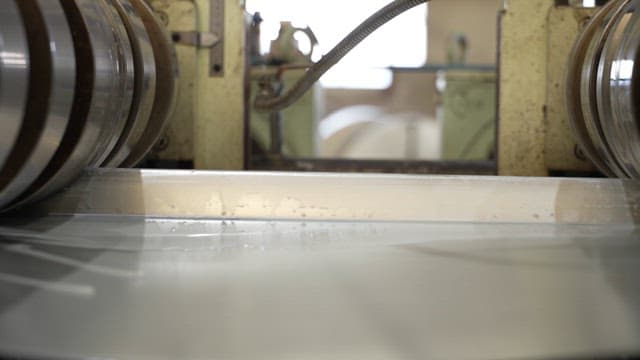 Metal sheets being processed in a factory