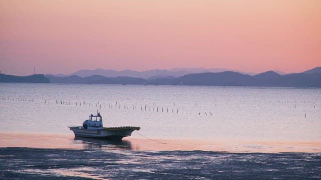 Boat on the Mudflats of Suncheon at Sunset