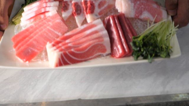 Sliced Raw Fish Served on a Plate