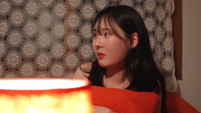 person listening to a story while holding a cushion