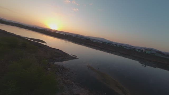 Sunset over a calm river landscape