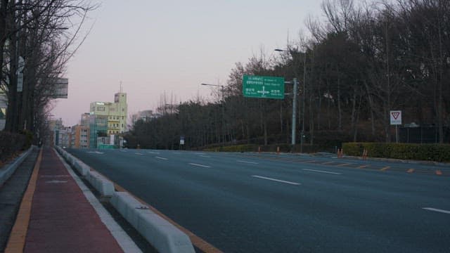 Empty Roads with Passing Cars at Twilight 