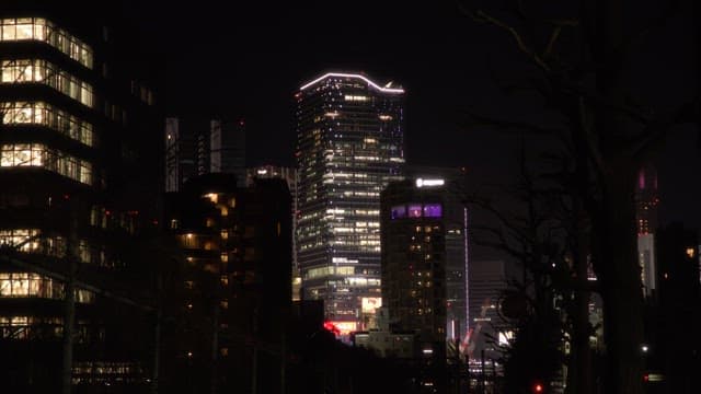 Nighttime city skyline with illuminated buildings