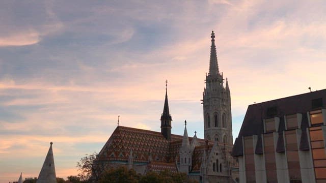 Silhouette of Historic Cathedral Against Sunset Sky