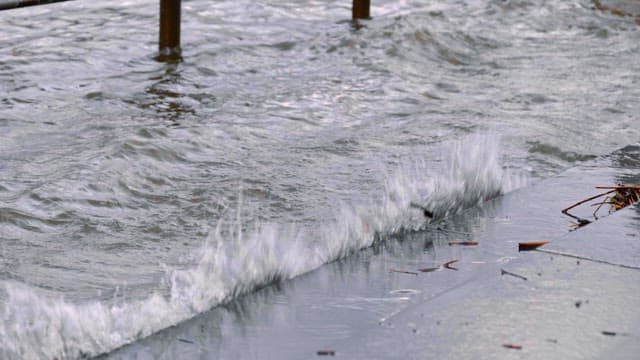 River overflowing beyond the fence