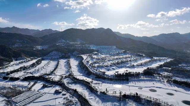 Snow-covered Landscape with Mountains and Trees