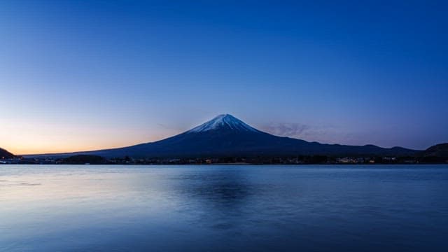 Mount Fuji at dawn with a calm lake