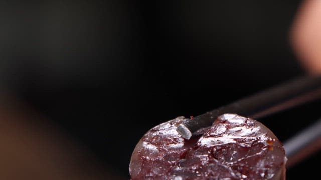 Chopstickful of glossy, appetizing sundae