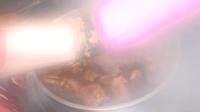 Pig's feet cooked in a large cauldron