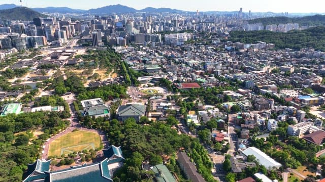 Vast cityscape with a mountain in the background