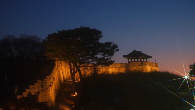 Illuminated fortress wall at dusk