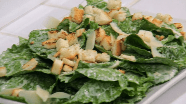 Fresh spring cabbage salad with croutons and cheese