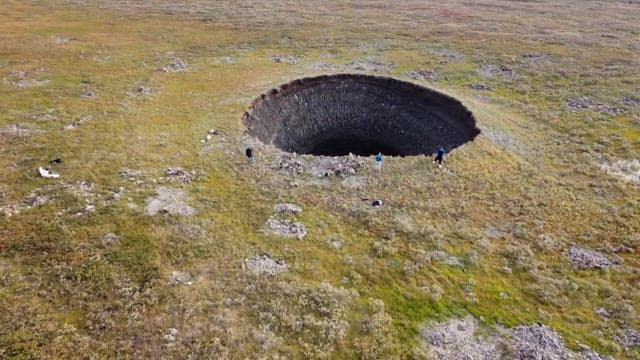 Explorers Surveying a Massive Natural Sinkhole