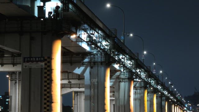 Illuminated Bridge Structure at Night
