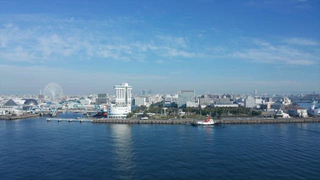 Serene coastal urban landscape under a clear blue sky