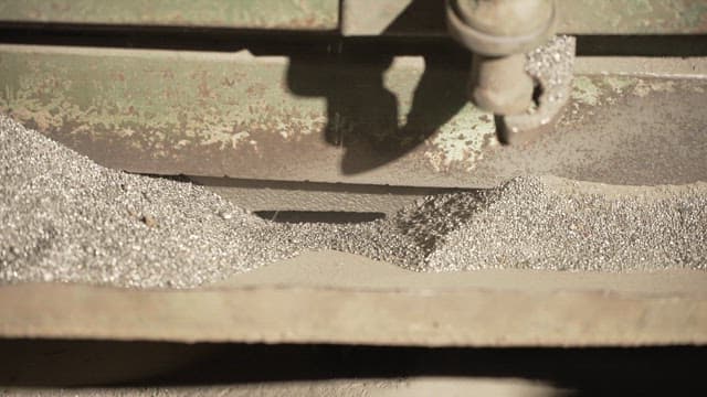 Metallic particles being processed