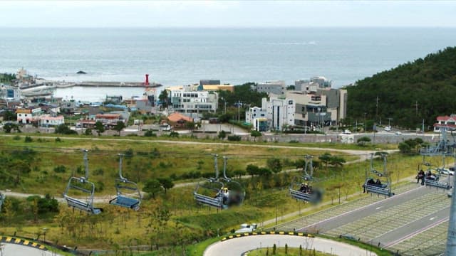 Cable cars with a view of the coast