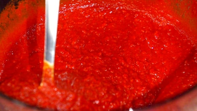 Spicy marinade being stirred in a bowl
