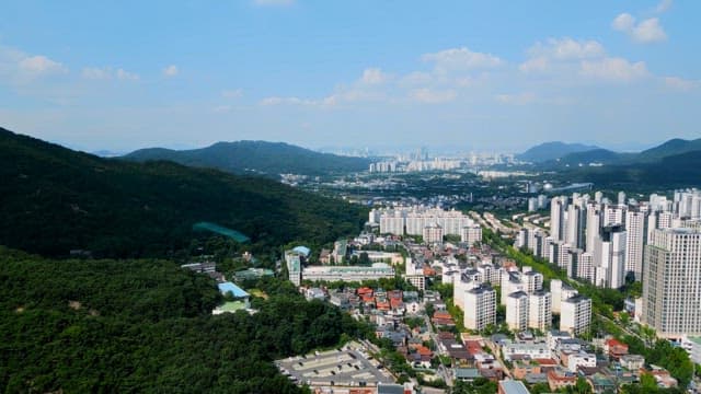 Cityscape with surrounding mountains