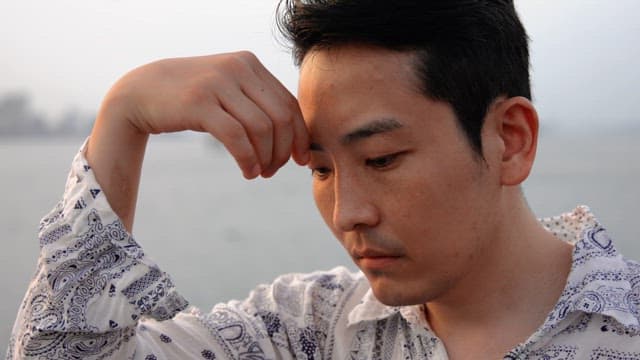 Man gazing thoughtfully at the sea