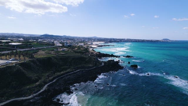 Coastal Village with Deep Blue Waves