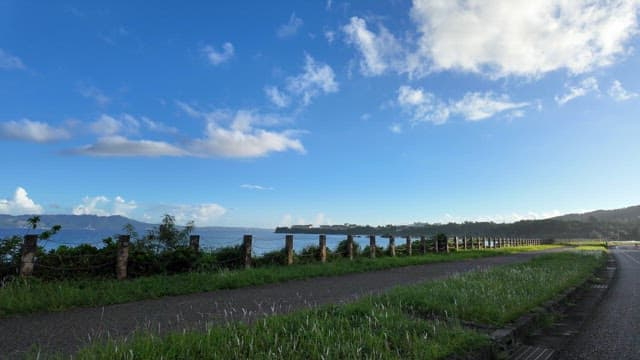 Coastal road with ocean and blue sky