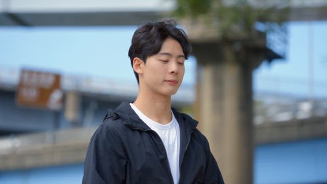 Young man standing confidently outdoors