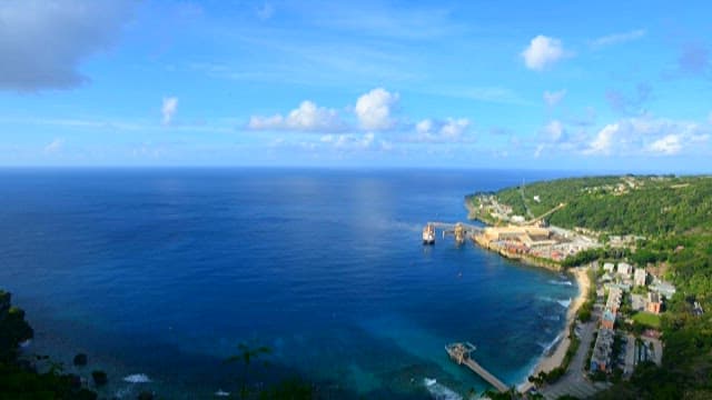 Coastal view with industrial port and town