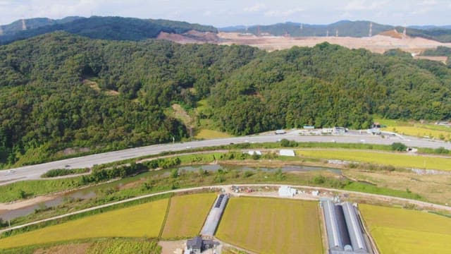 Expansive farmland with greenhouses