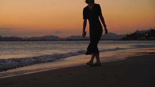 Serene beach stroll at sunset