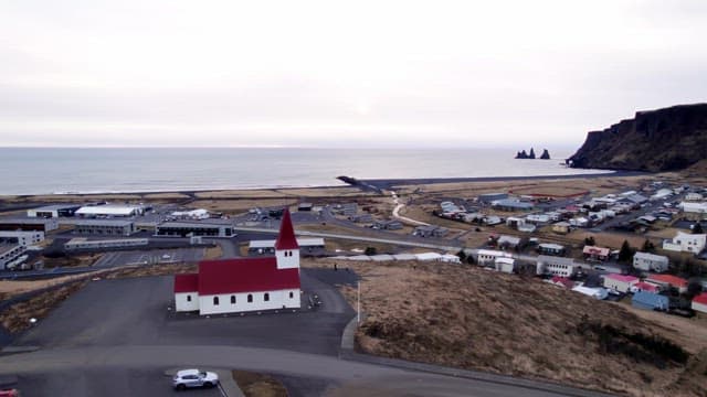 Coastal town with a red-roofed church
