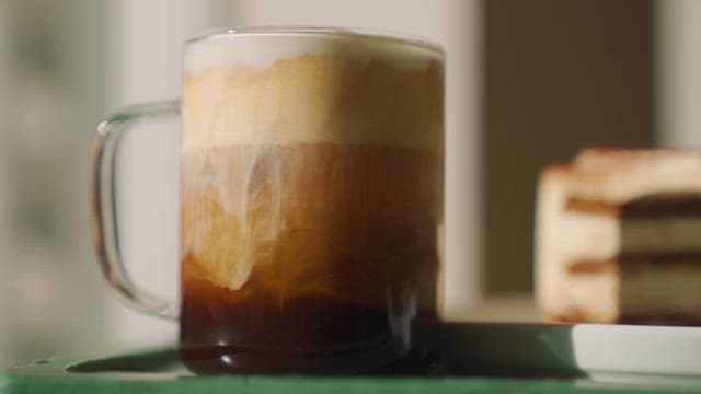 Close-up of a drink and dessert on a table