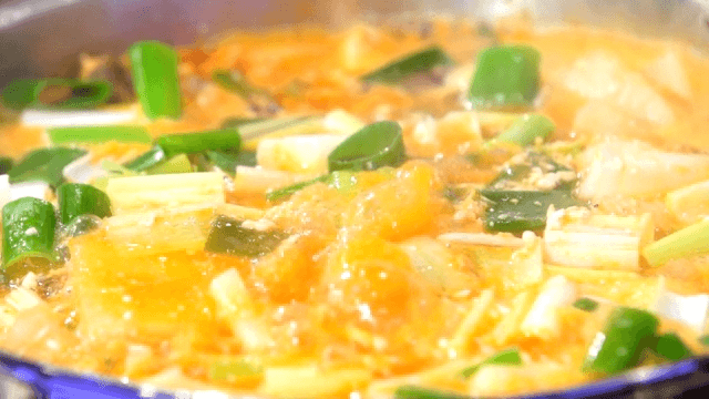 Spicy seafood stew boiling in a pot