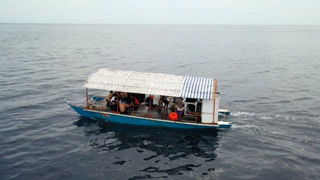 Banka, a traditional Filipino boat that crosses the calm sea