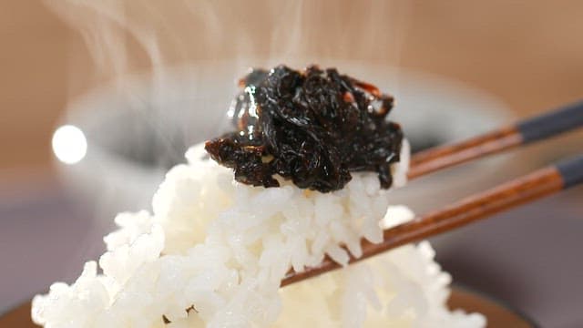 Seaweed dish eaten with white rice using chopsticks