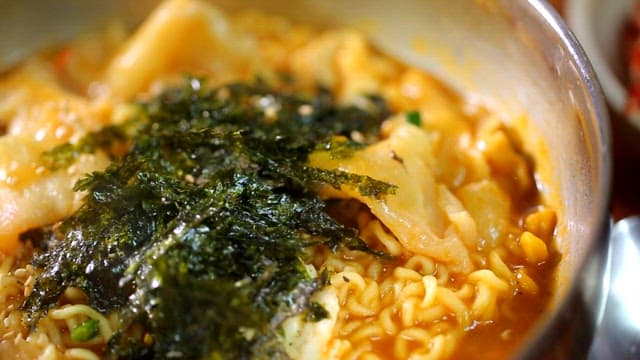 Hand-pulled dough ramyeon with seaweed on it