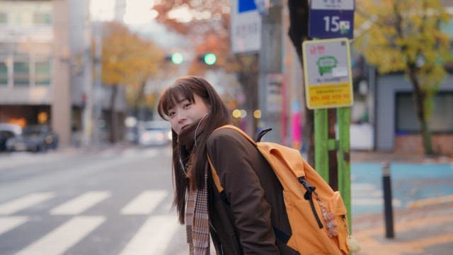 Student waiting at a bus stop