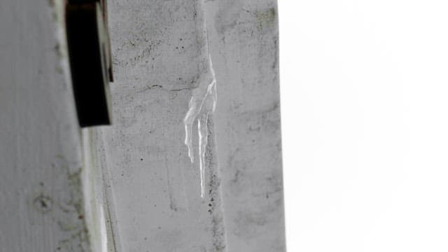 Icicles forming on a wall on a cold winter day