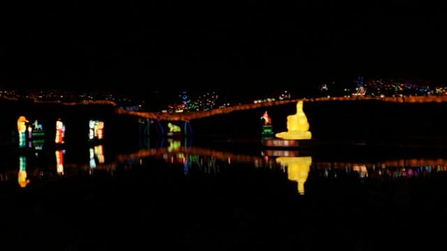 Colorful Lantern Decorations Floated on the River on a Dark Night for the Festival