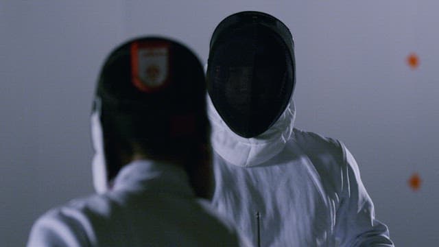 Two Fencing Athletes in Duel