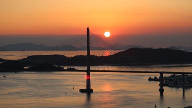 Sunset Over a Suspension Bridge and Bay