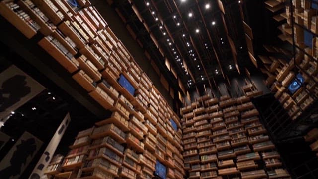 Expansive View of a Modern Library with Many Books on the Shelves
