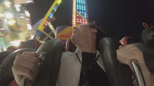 Night ride on an exhilarating amusement park ride
