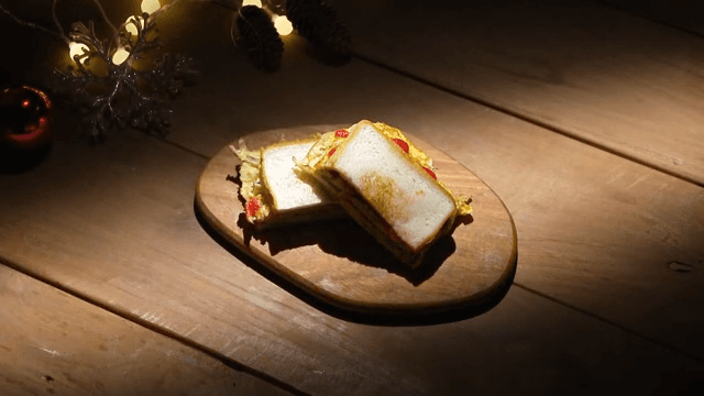 Delicious toast plated on a wooden table under dim lighting