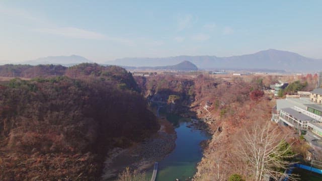 Serene river flowing through rocky cliffs