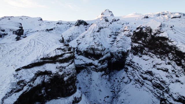 Snow-covered mountains with a deep gorge