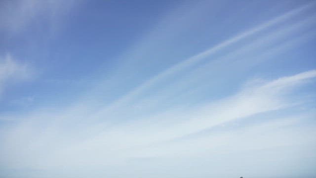 Wide tidal flats and sea under the blue sky